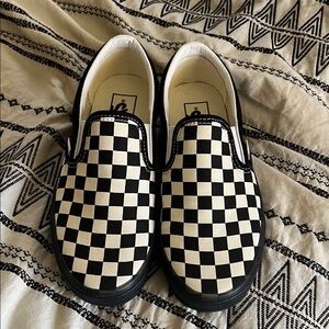 Black checkered slip on Vans